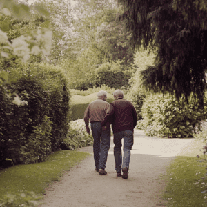 two older gentlemen walking in a garden. How to support aging parents without taking over.