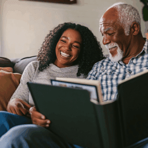 A father and daughter looking through a photo album. Communication tools for dementia.