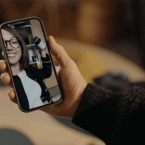 A mobile phone showing a video playing. How Video Message Apps Support Dementia Care.